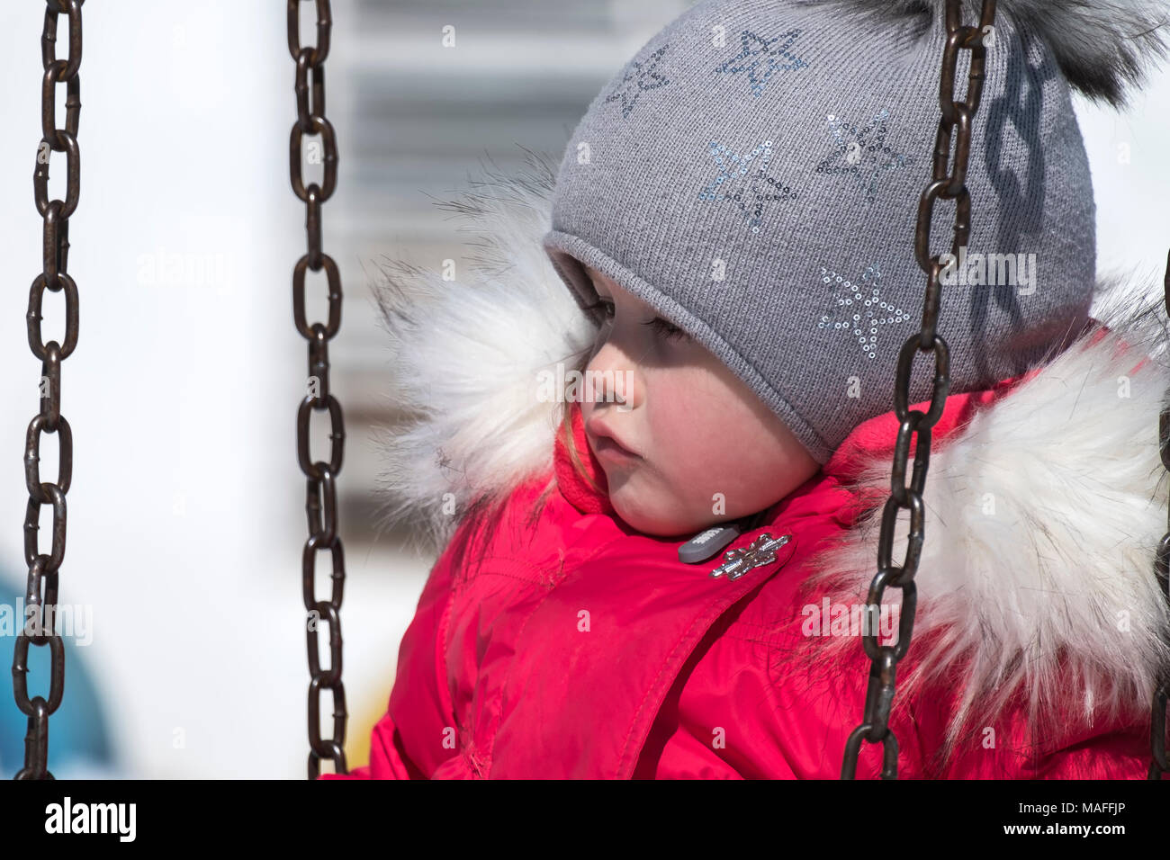 Little girl in a red down jacket was offended Stock Photo Alamy