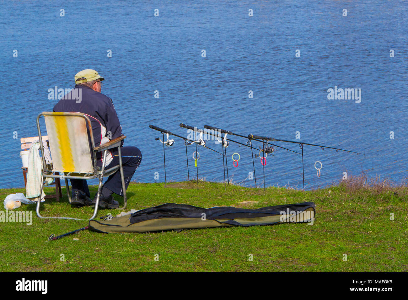 Fisherman with rods. Waiting fish to bite hook Stock Photo - Alamy