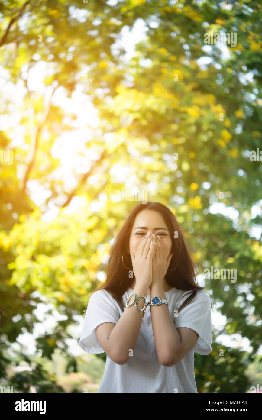 Portrait of a smiling girl relaxing in nature park outdoors Stock Photo ...