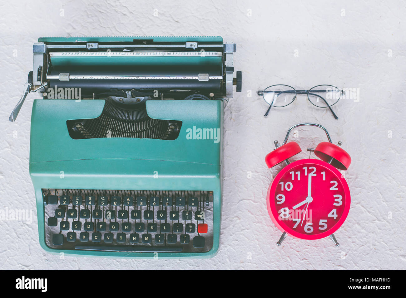 Top View Of Vintage Typewriter With Red Alarm Clock And Eye