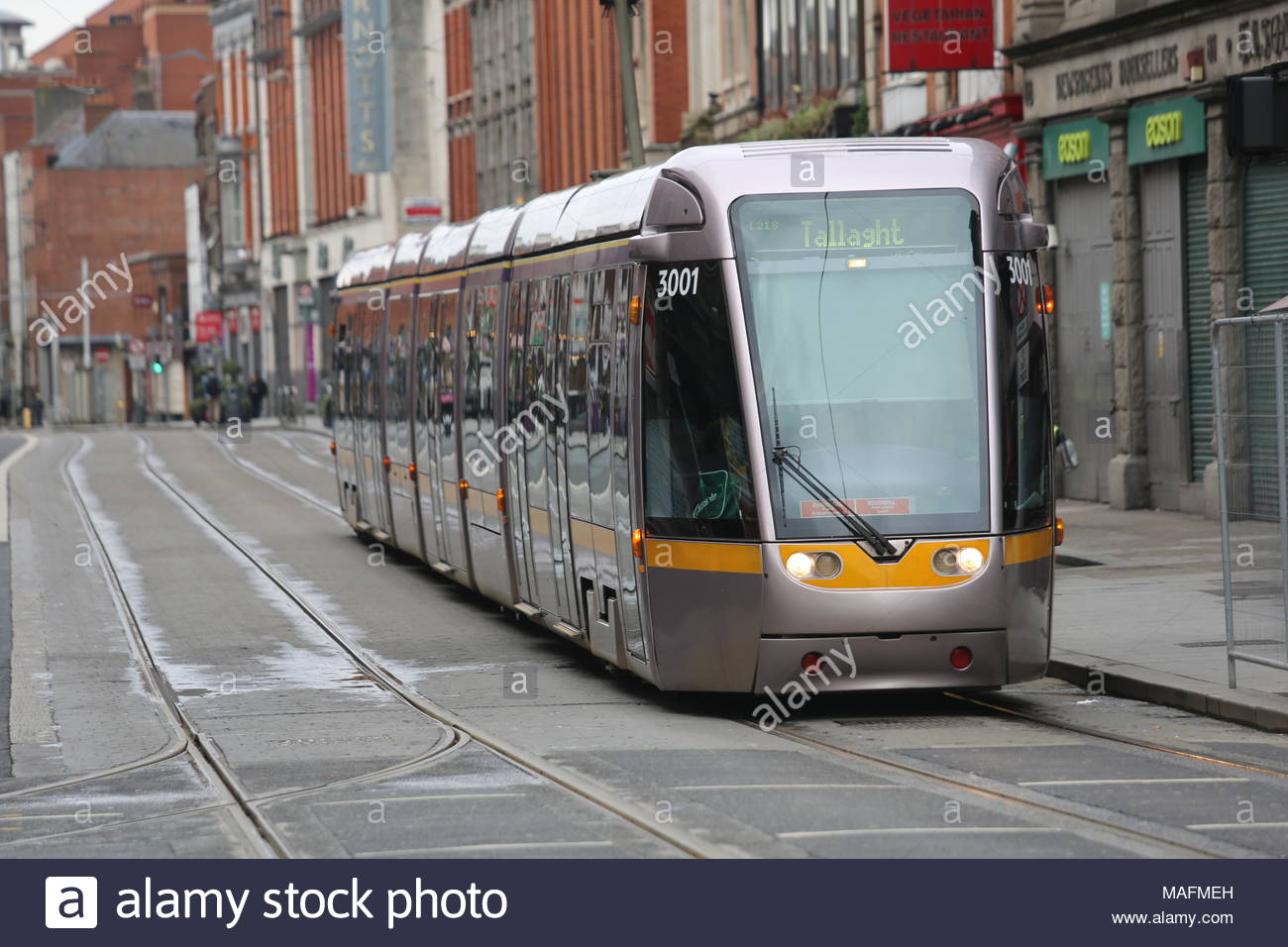 A Luas tram in inner Dublin, Ireland at a time when the Luas system has been rapidly developed and is being used by many commuters in the capital city Stock Photo