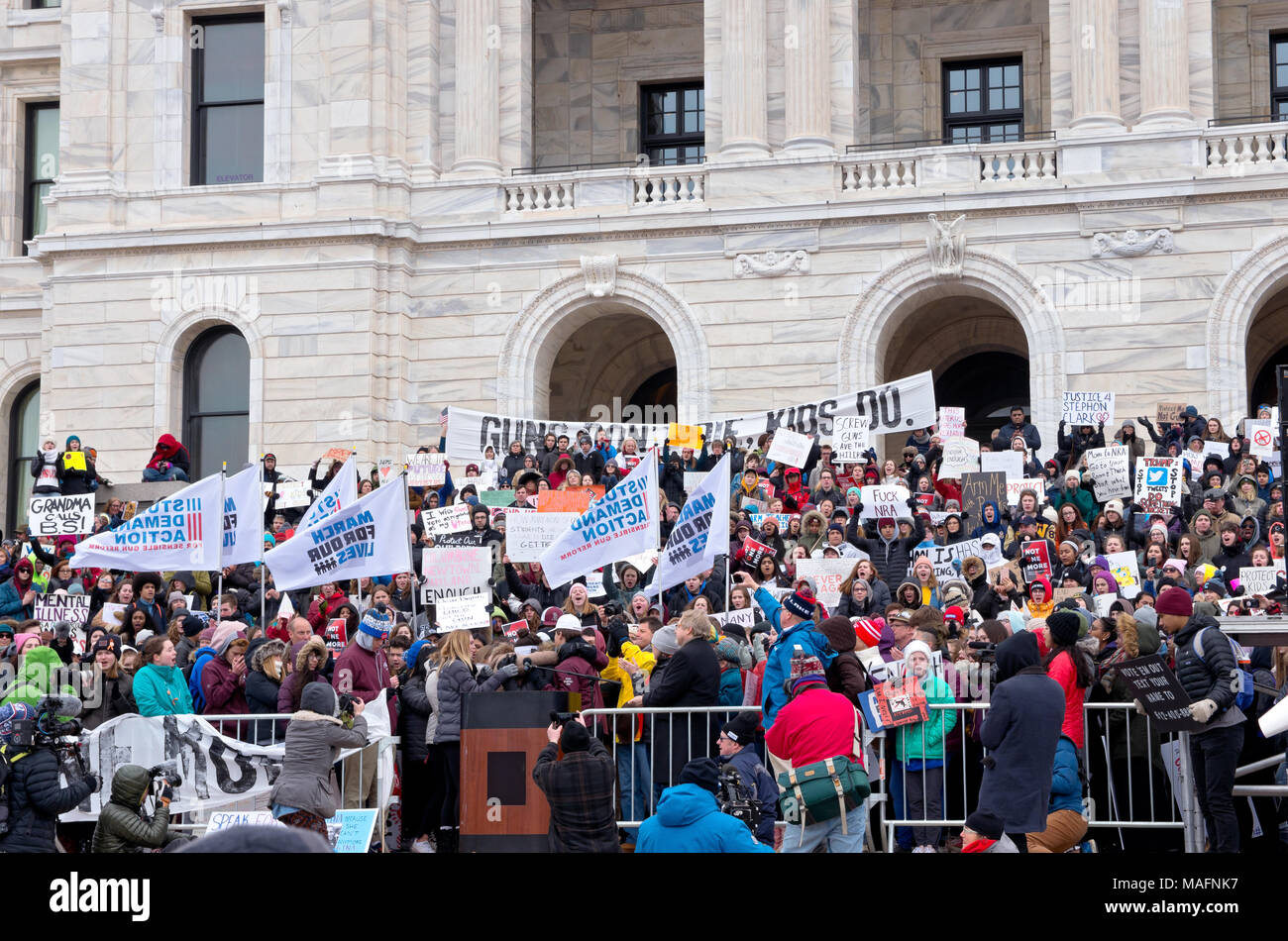 SAINT PAUL, MN/USA – MARCH 24, 2018: Students embrace each other after emotional speech to crowd at State Capitol during March for Our Lives rally. Stock Photo