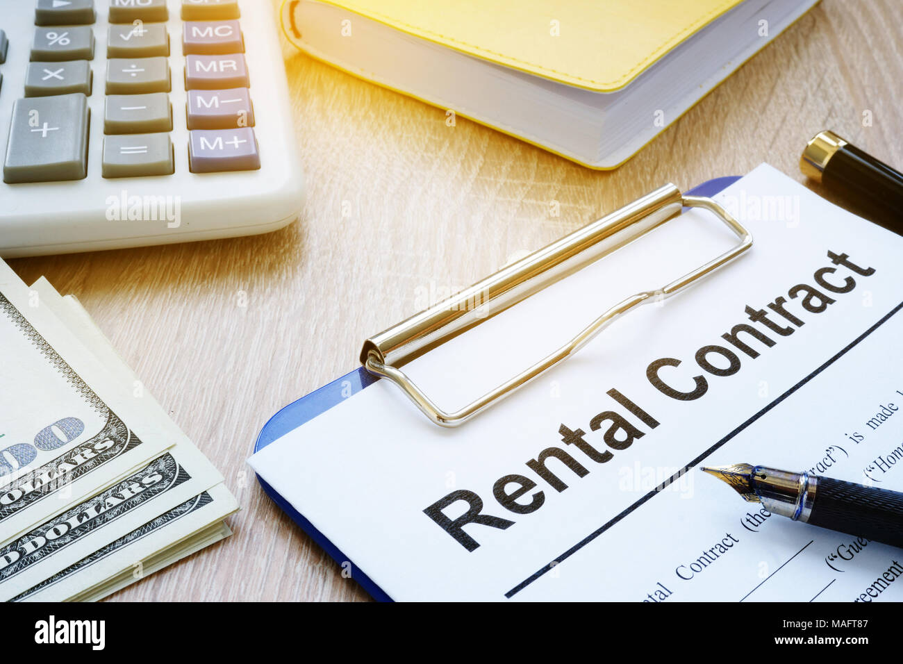 Rental Contract form and money. Rent of apartments. Stock Photo