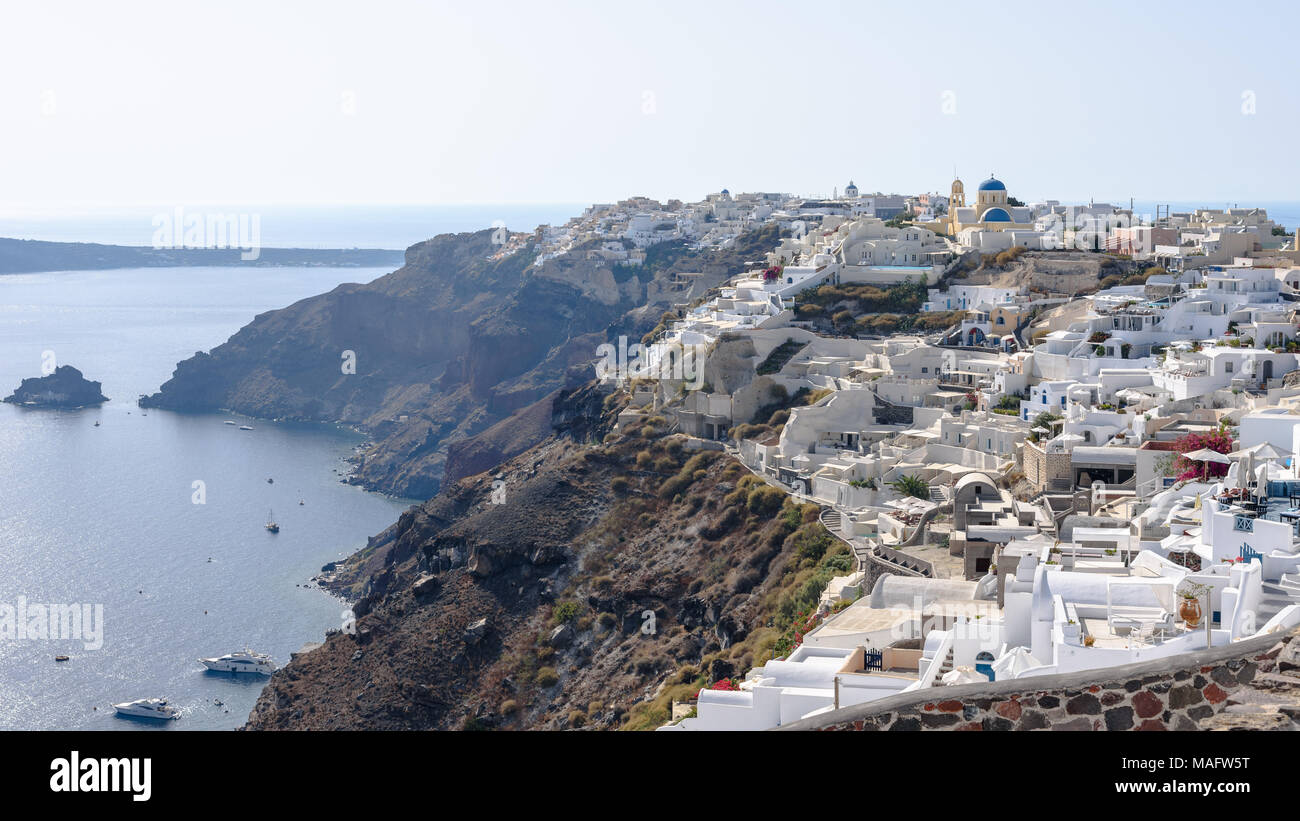 Oia on the steep hillside above the Santorini caldera and the Aegean Sea Stock Photo