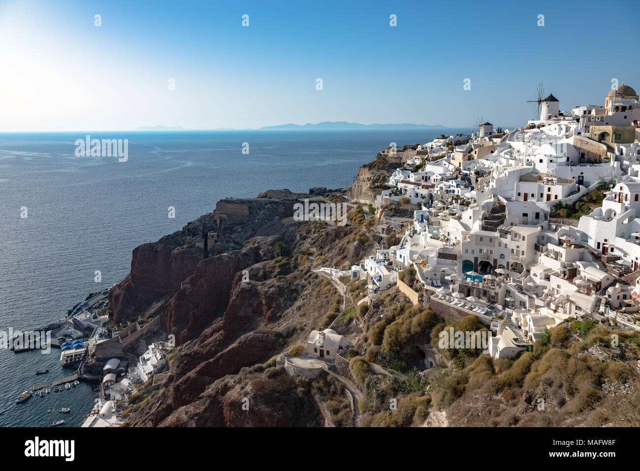 Looking over Oia on the  Santorini hillside during the day Stock Photo