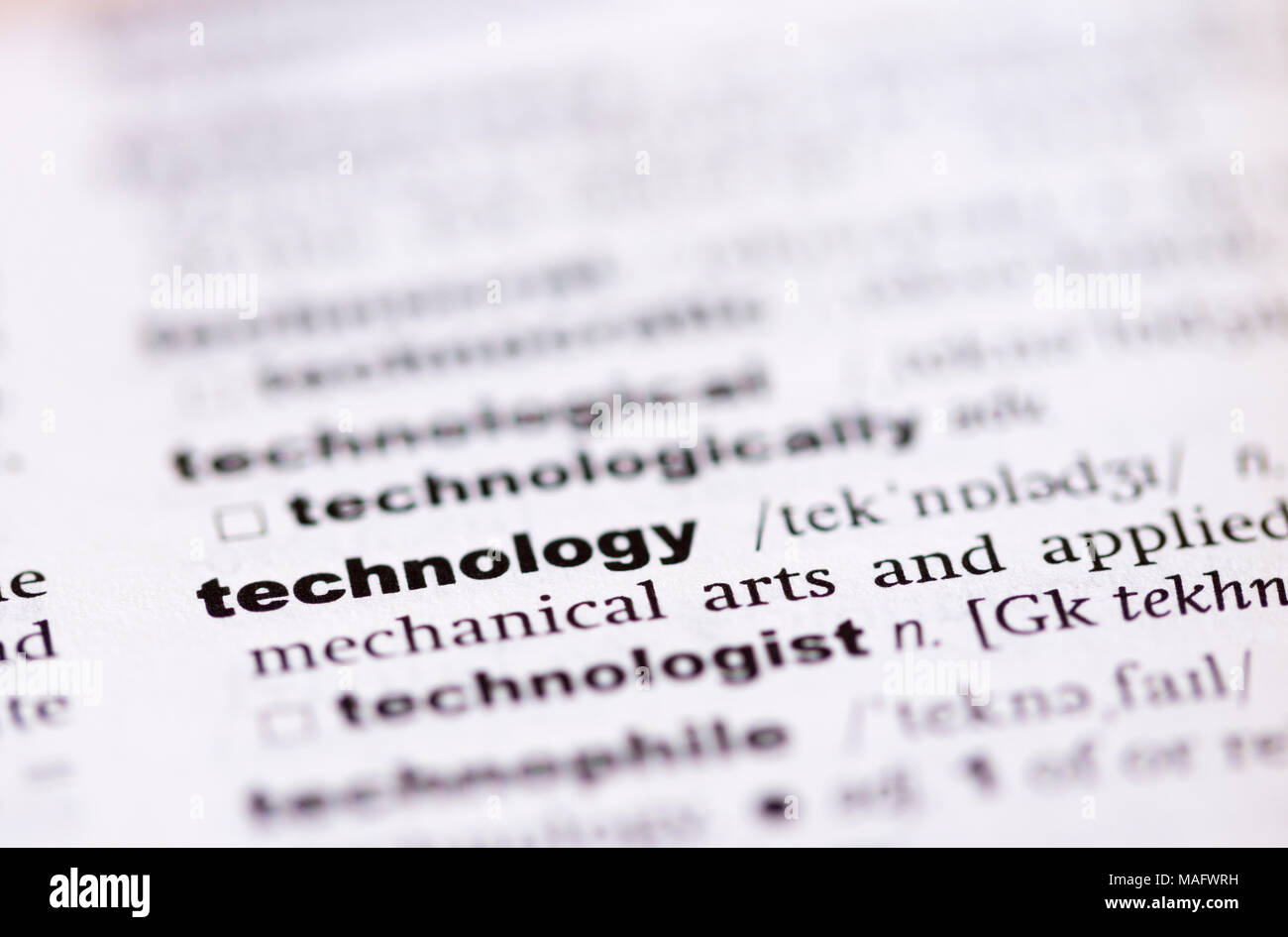 A macro shot showing the definition of the word technology in an English dictionary Stock Photo
