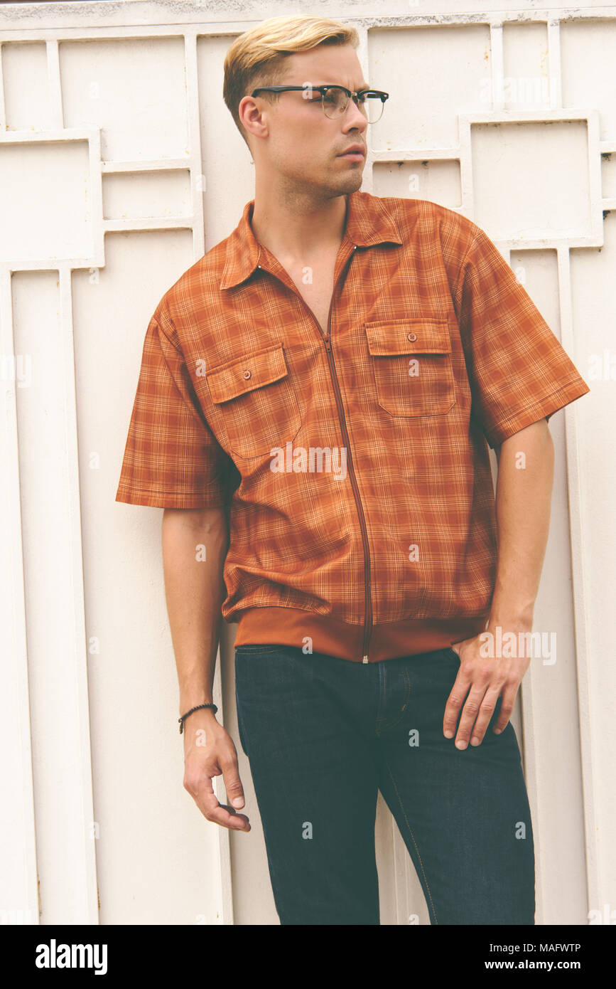 A Caucasian man, male model posing wearing men's 70s vintage shirt, a men's vintage fashion editorial concept. Stock Photo