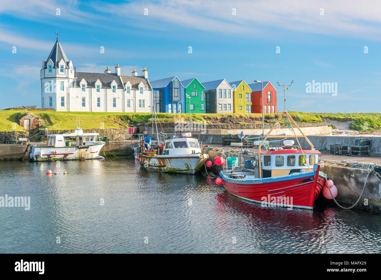 The colorful buildings of John O'Groats in a sunny afternoon, Caithness county, Scotland. Stock Photo