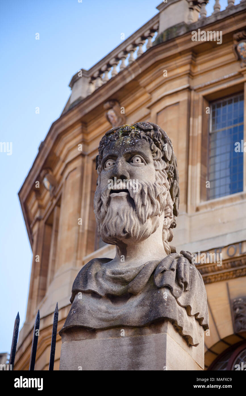 Grotesque roman style bust at the Sheldonian Theatre, Oxford University, Oxford, Oxfordshire, South East England, UK Stock Photo