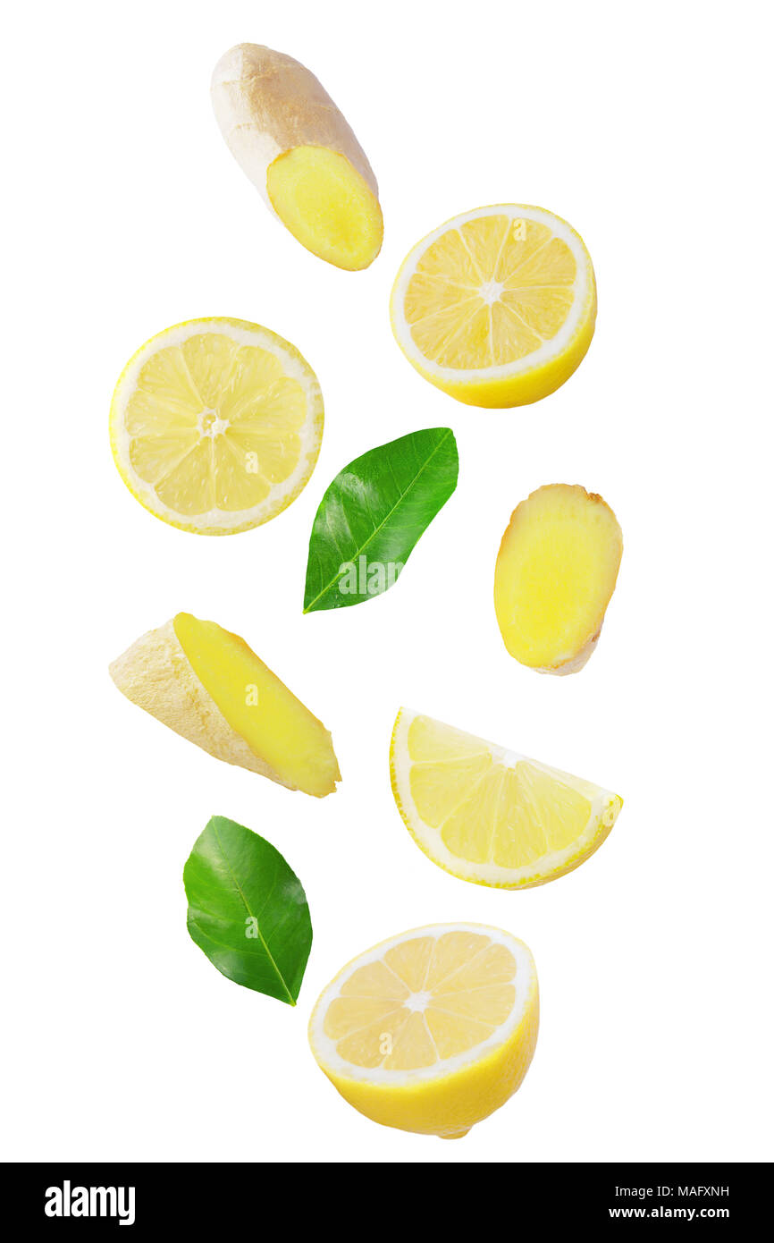 Isolated flying citrius. Fresh falling lemon and ginger isolated on white background with clipping path as a packaging design and advertising. Stock Photo