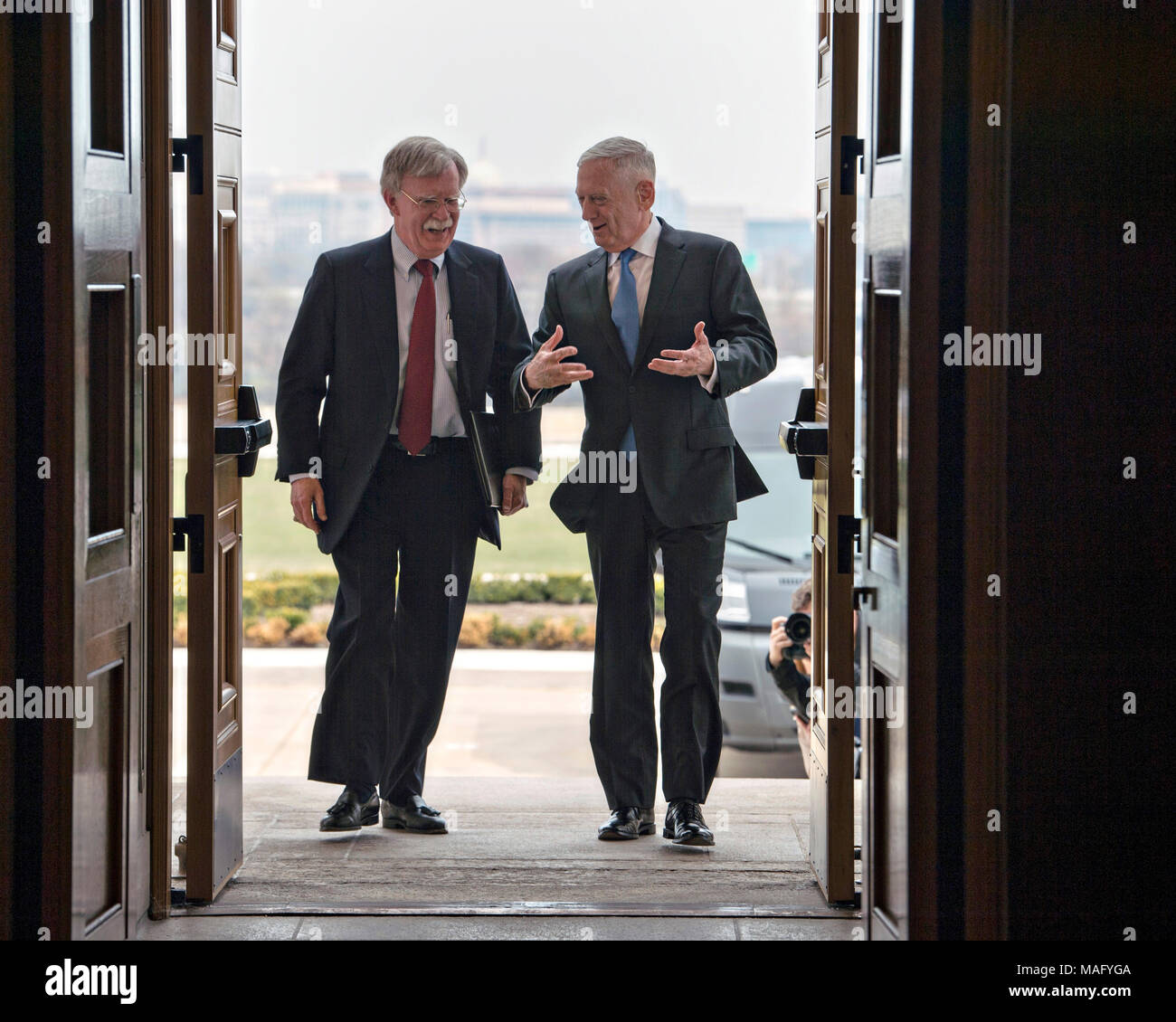 U.S. Secretary of Defense James Mattis, right, escorts the newly appointed National Security Advisor John Bolton on arrival at the Pentagon March 29, 2018 in Arlington, Virginia. Stock Photo