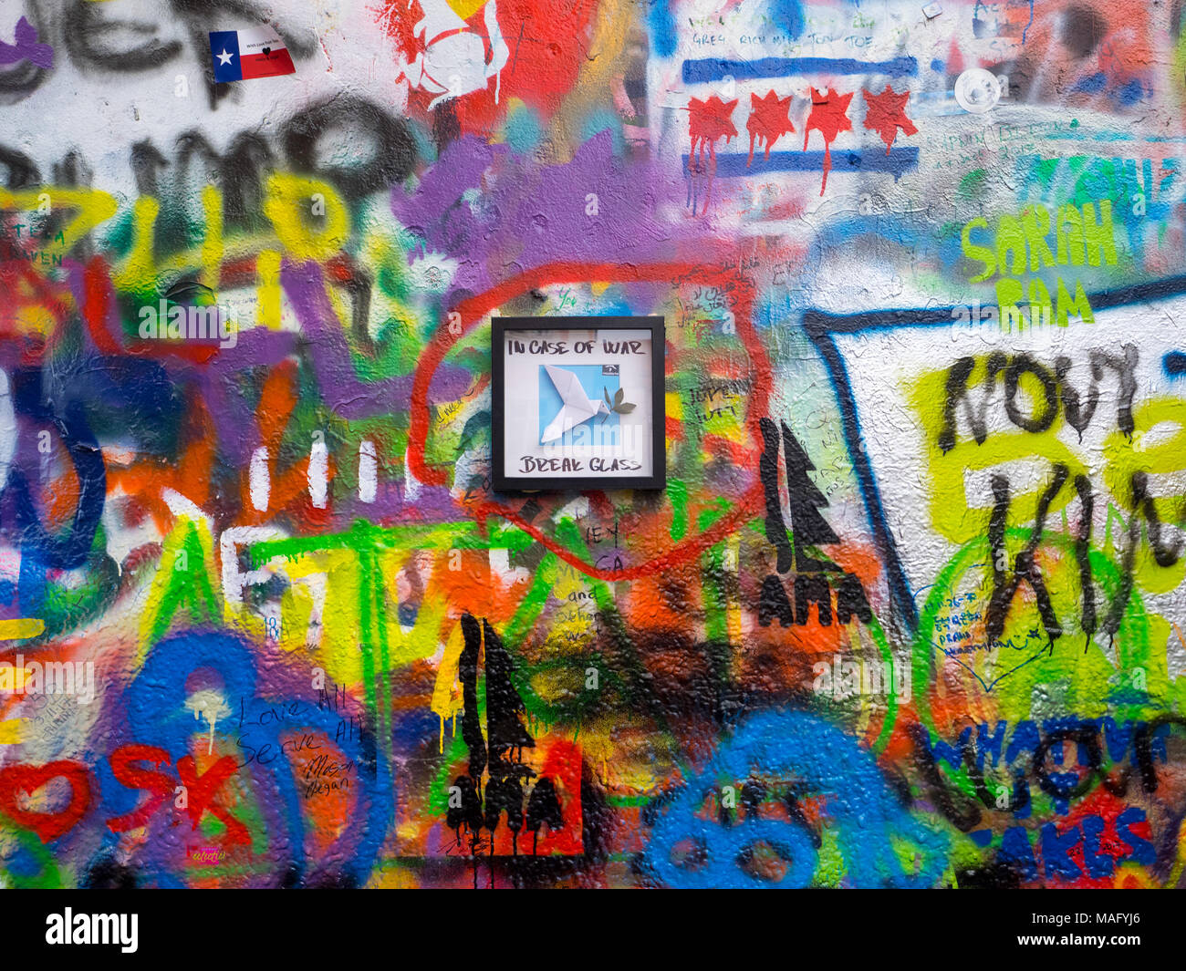 Graffiti and messages of peace on John Lennon tribute colored wall in Prague, Czech Republic