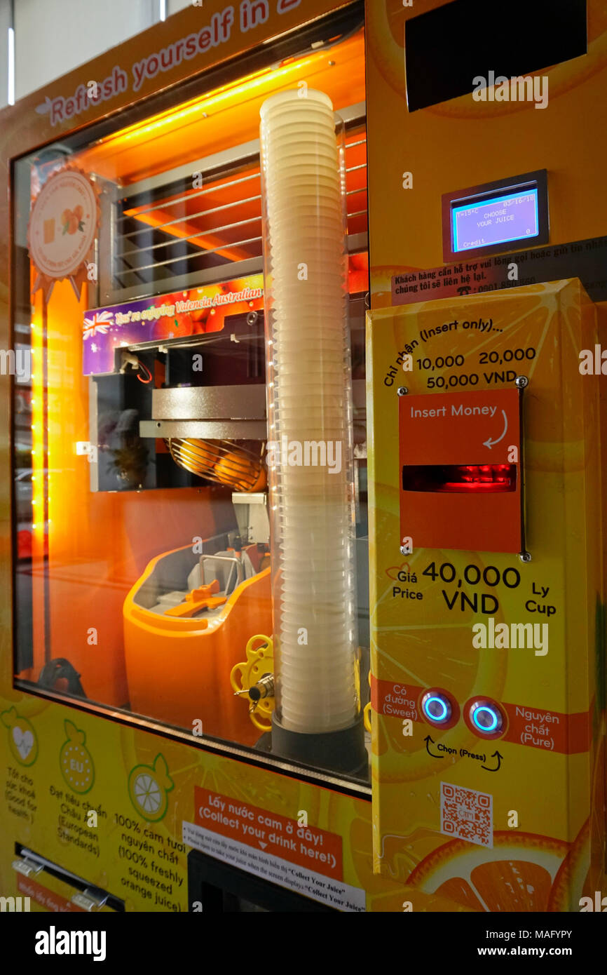 Fresh Orange juice vending machine, Vietnam Stock Photo - Alamy