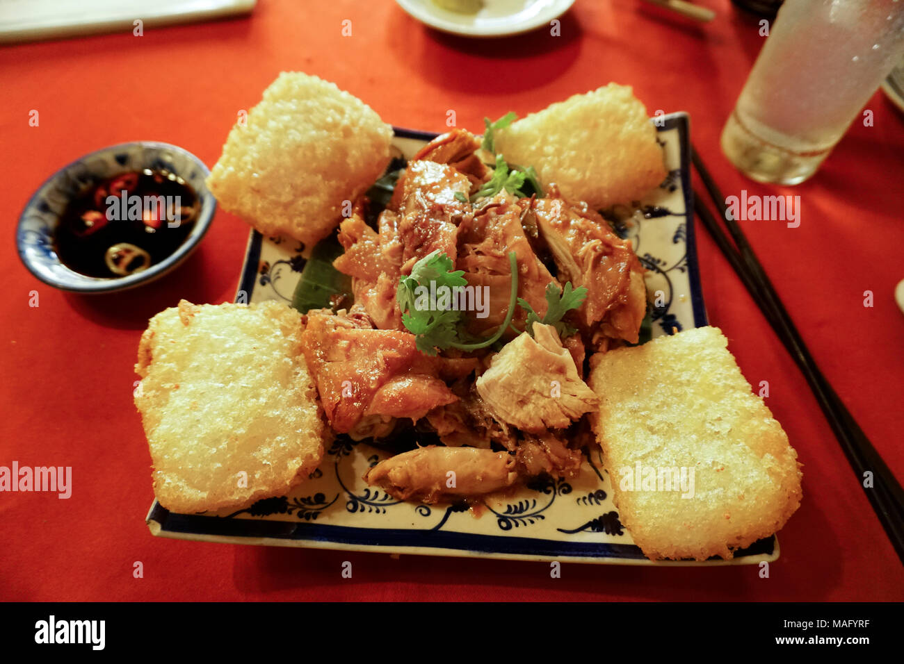 Xoi Chein Ga Roti (Vietnamese Roasted Chicken) and fried sticky rice, Ho Chi Minh City, Saigon, Vietnam Stock Photo