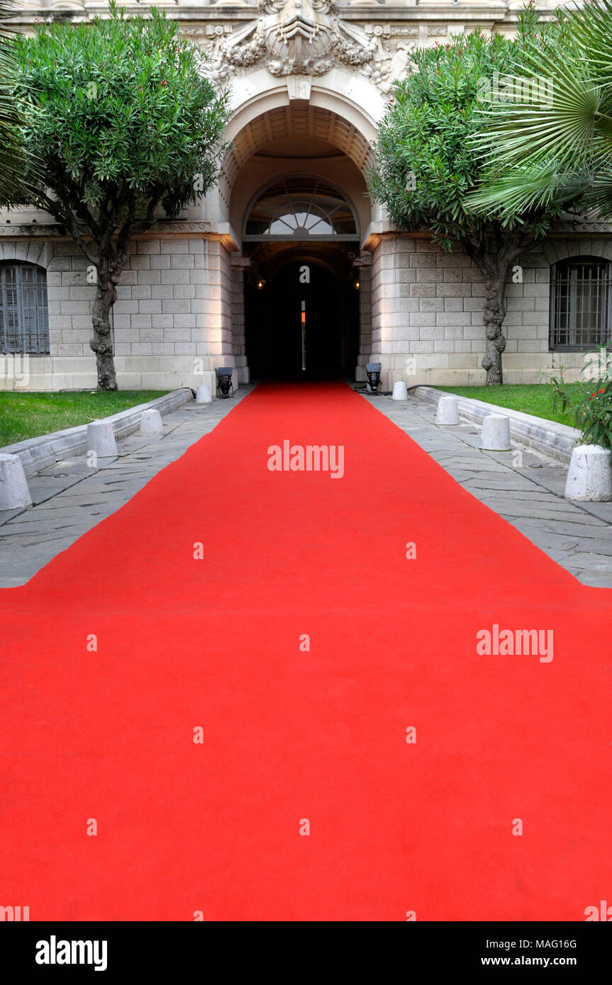 Red carpet laid in front of a luxury hotel Stock Photo