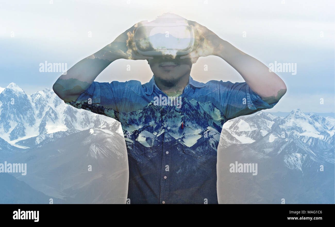 Double exposure Asian Man wearing virtual reality with snow mountain ...
