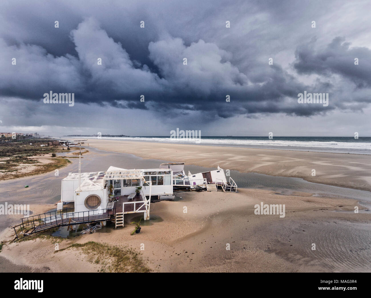 Beach bar destroyed by storm. Tarifa, Costa de la Luz, Cadiz, Andalusia, Southern Spain. Stock Photo