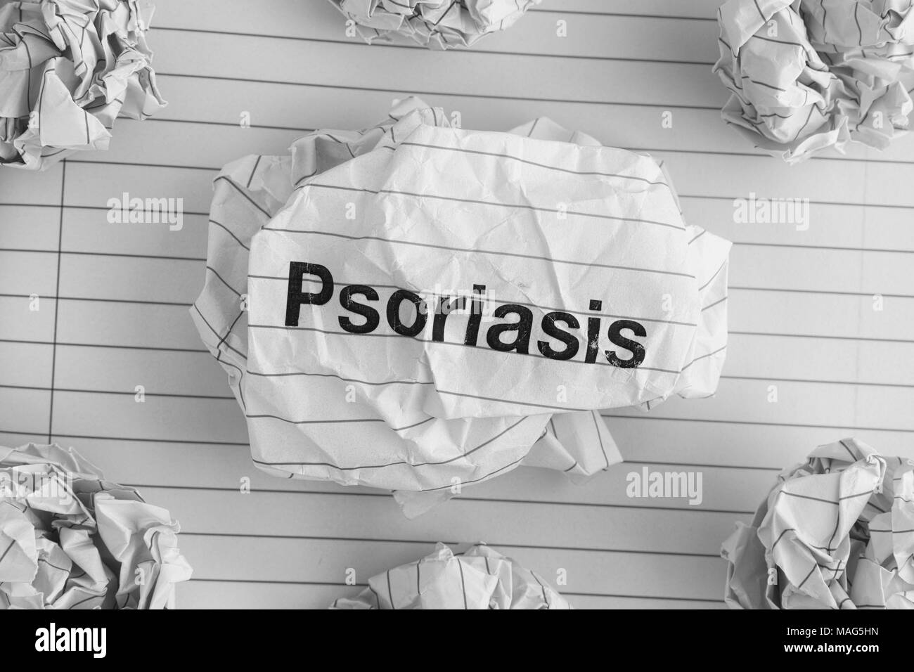 Psoriasis. Word Psoriasis on Crumpled Paper Ball. Close up. Stock Photo