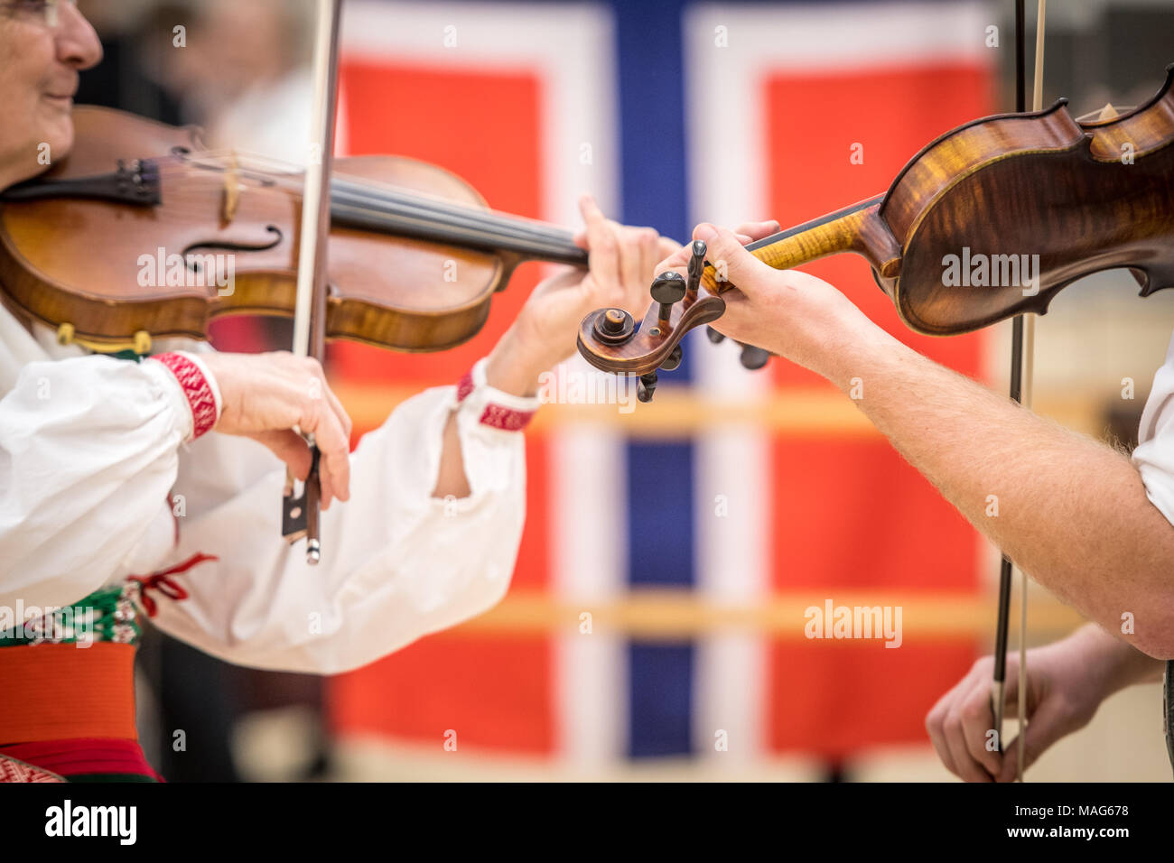 Two violinists play a song on the Swedish Fiddle Stock Photo