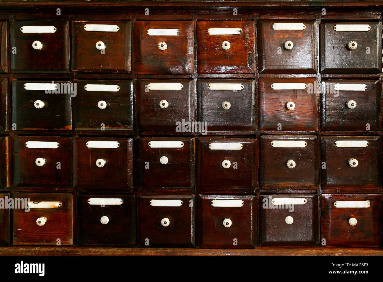 Retro Background Of Many Old Square Wooden Brown Drawers With
