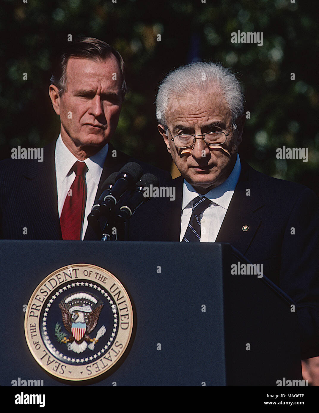 Washington, DC., USA, October 11, 1989 President George H.W. Bush greets Italian President Francesco Cossiga at the South Portico of the White House, where President Cossiga was accorded a formal welcome with full military honors. President Cossiga spoke in Italian, and his remarks were translated by an interpreter. Credit: Mark Reinstein/MediaPunch Stock Photo