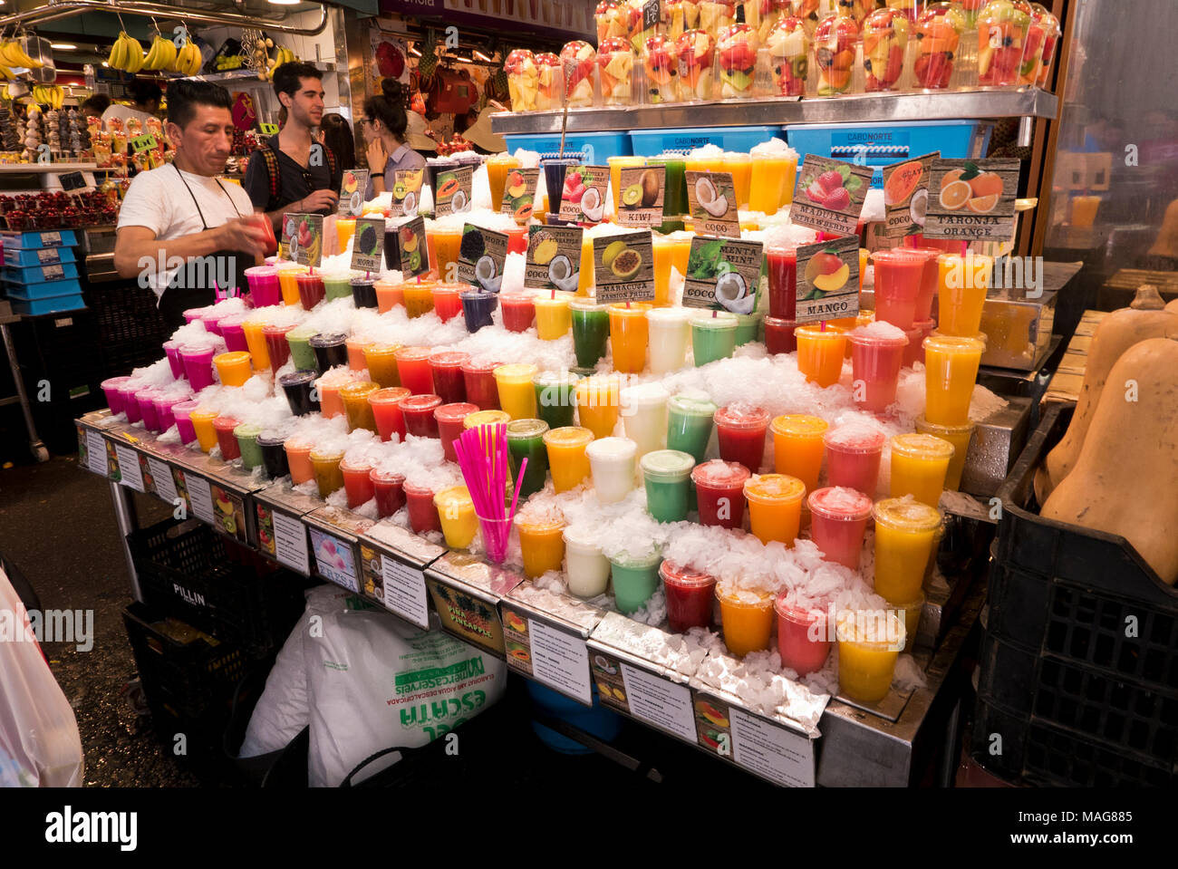 Fresh fruit juices for sale in La Boqueria indoor market near La Rambla