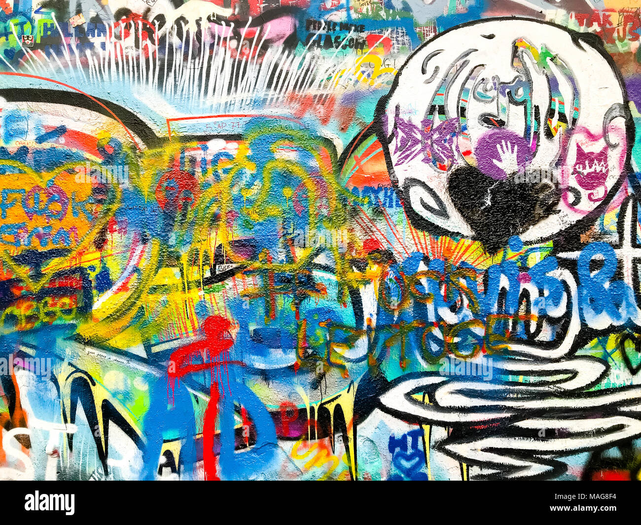 John Lennon tribute wall in Prague city center, covered with colorful graffiti and paintings by common people Stock Photo
