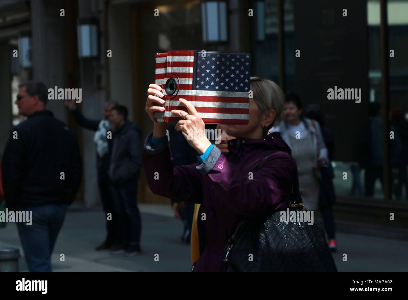 New York, USA. 01st Apr, 2018. New York, NY US. 1st. Apr, 2018. The annual holiday parade attracted a large crowd of all ages and from around the world featuring revelers dressed in colorful outfits, bunny ears and - the always anticipated - creative hats and bonnets. The Easter parade and bonnet festival was made famous by Irving Berlin's song, 'Easter Parade,' in 1933. The song was later featured in the film 'Easter Parade' starring Judy Garland and Fred Astaire. © 2018 Credit: G. Ronald Lopez/Alamy Live News Stock Photo