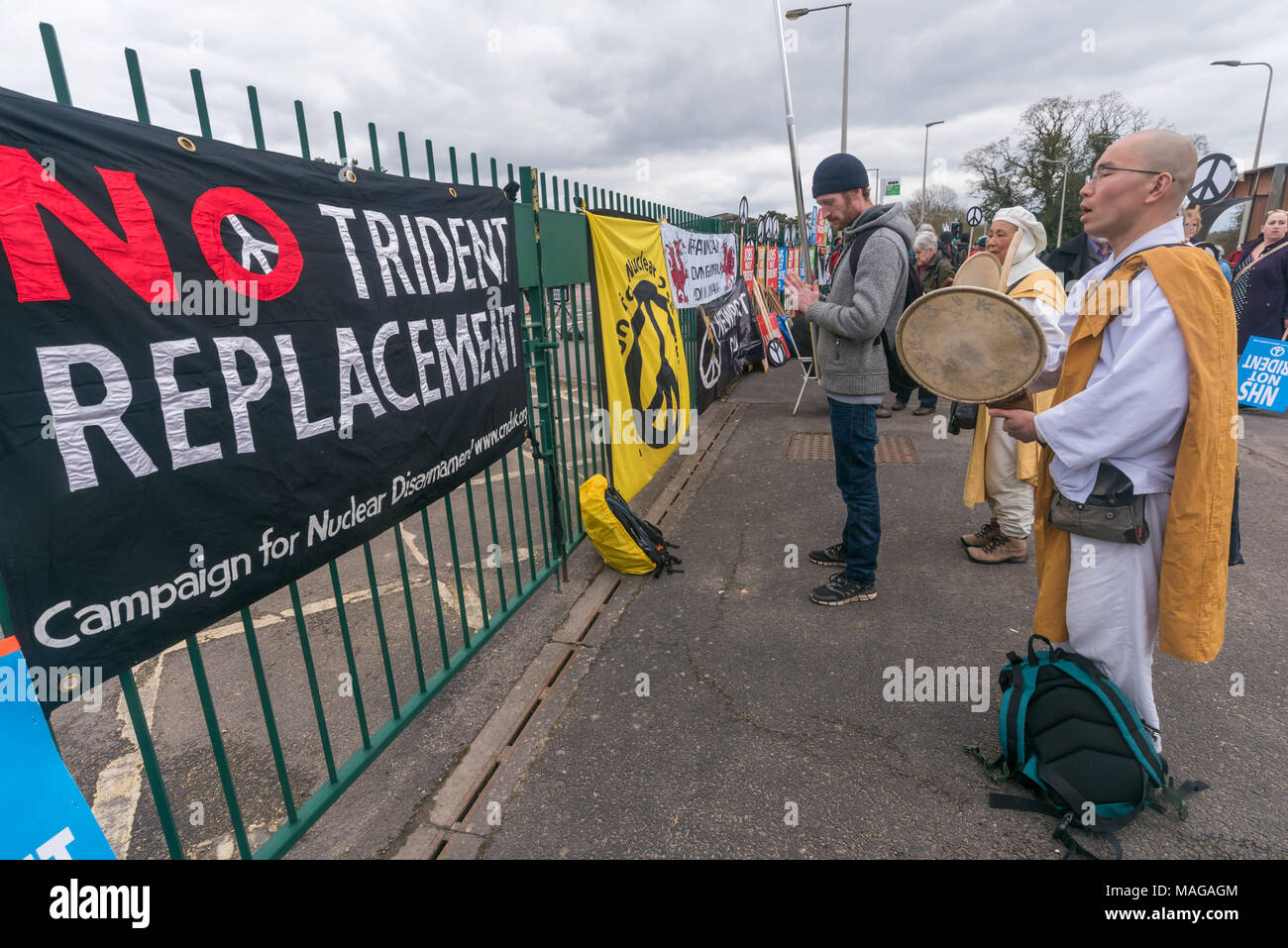 Aldermaston, UK. 1st Apr, 2018. Japanese Buddhist monks from Japan and Milton Keynes take part in the CND celebration of  the 60th anniversary of the first Aldermaston march which mobilised thousands against the Bomb and shaped radical protest for generations. Their protest outside the Atomic Weapons Establishment included a giant, iconic peace symbol, speeches, including by some of those on the original march, singing and drumming and celebrated the UN treaty banning nuclear weapons. Credit: Peter Marshall/Alamy Live News Stock Photo