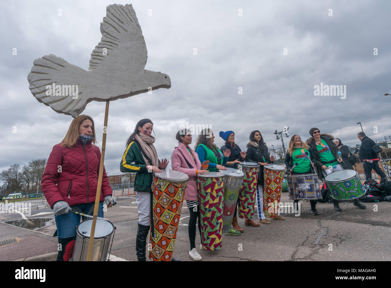 Aldermaston, UK. 1st Apr, 2018. Samba band TRibo plays as CND celebrates the 60th anniversary of the first Aldermaston march which mobilised thousands against the Bomb and shaped radical protest for generations. Their protest outside the Atomic Weapons Establishment included a giant, iconic peace symbol, speeches, including by some of those on the original march, singing and drumming and celebrated the UN treaty banning nuclear weapons. Campaign to abolish nuclear weapons. Credit: Peter Marshall/Alamy Live News Stock Photo