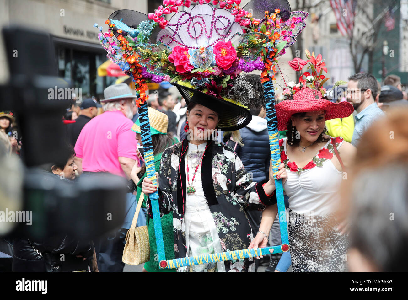 New York, USA. 1st Apr, 2018. Women in decorative bonnets take part in the Easter  Bonnet Parade in New York, the United States, April 1, 2018. The annual Easter  Bonnet Parade took