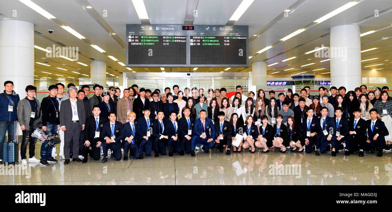 South Korean art troupe and taekwondo athletes in Pyongyang, Mar 31, 2018 : South Korean art troupe and taekwondo athletes pose for photos upon their arrival at Sunan airport in Pyongyang, North Korea. South Korean taekwondo athletes and K-Pop musicians such as Cho Yong-pil, Lee Sun-hee, Choi Jin-hee, Yoon Do-hyun (YB), Baek Ji-young, Red Velvet, Jungin, Seohyun (Girls' Generation), Ali, Kang San-eh and Kim Kwang-min will perform at the East Pyongyang Grand Theater on Sunday and will perform in a joint concert with North Korean artists on Tuesday at the Ryugyong Jong Ju Yong Gymnasium in Pyong Stock Photo