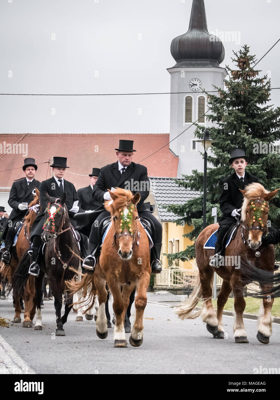 Lausitz, Germany. 1st Apr, 2018. Easter riders (Osterreiter) riding through Ralbitz (with the church in the background) during the Sorbian Easter Procession Credit: Krino/Alamy Live News Stock Photo