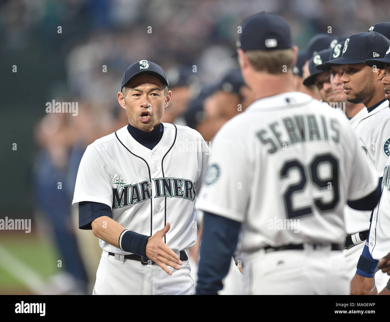 Ichiro Suzuki of the Seattle Mariners embraces manager Scott