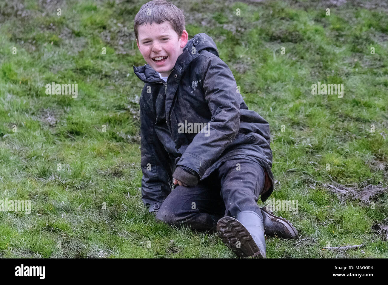 Preston, UK. 2nd April, 2018. It was a cold and damp day on Avenham Park in Preston, the venue for the traditional Easter egg rolling event.  It’s normally one of Preston’s biggest events of the year. Despite the weather the people of Preston still turned out in numbers, albeit fewer than usual to enjoy the egg rolling and entertainment throughout the day.   The tradition of rolling eggs down the grassy park hills goes back hundreds of years and is sometimes referred to as ‘pace egging’. Credit: Paul Melling/Alamy Live News Stock Photo