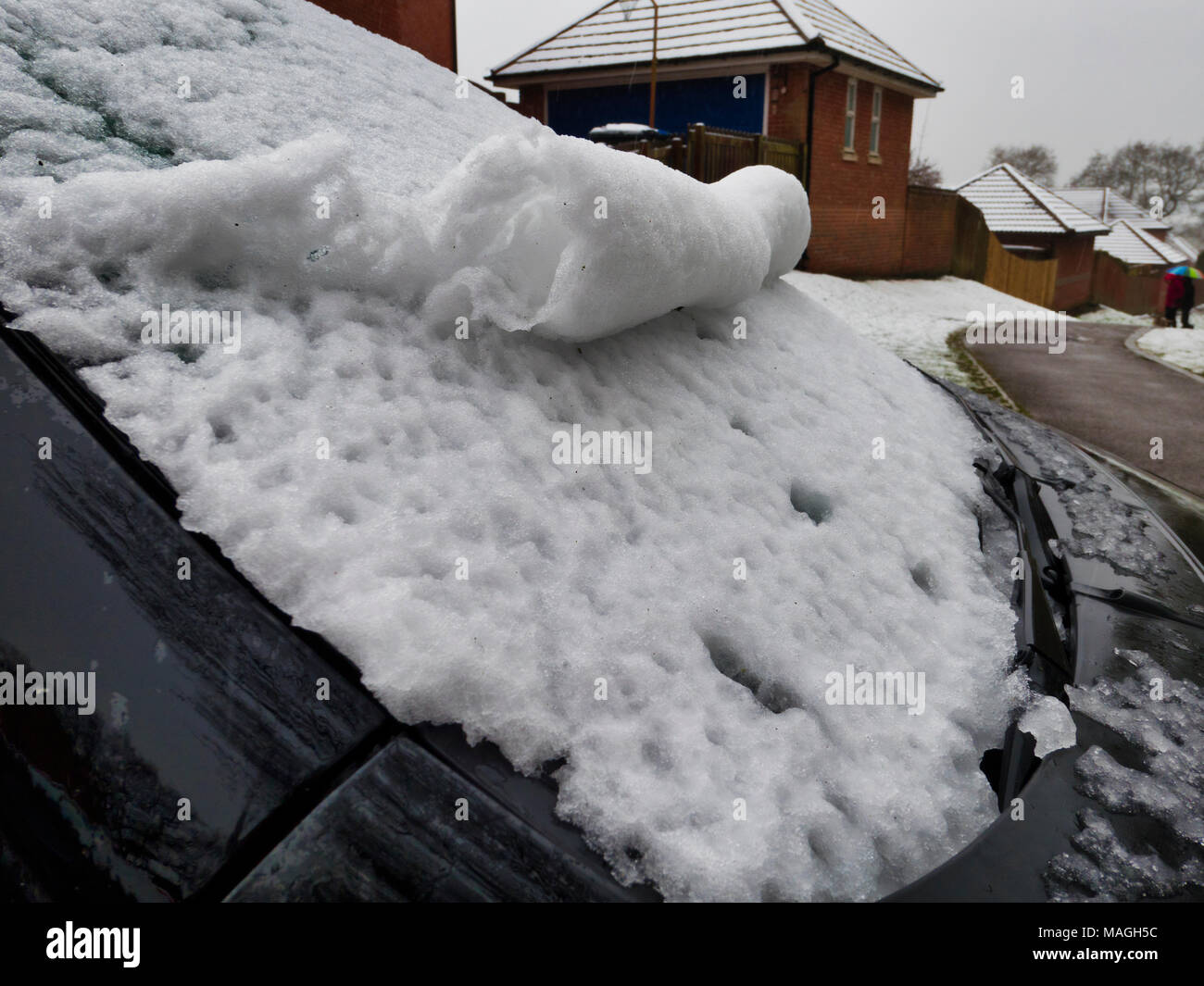Ashbourne, Derbyshire. 2nd Apr, 2018. UK Weather: snow scrolls on a car windscreen 1' of morning snow quickly melts causing flooding on Easter Bank Holiday Monday in Ashbourne, Derbyshire Credit: Doug Blane/Alamy Live News Stock Photo