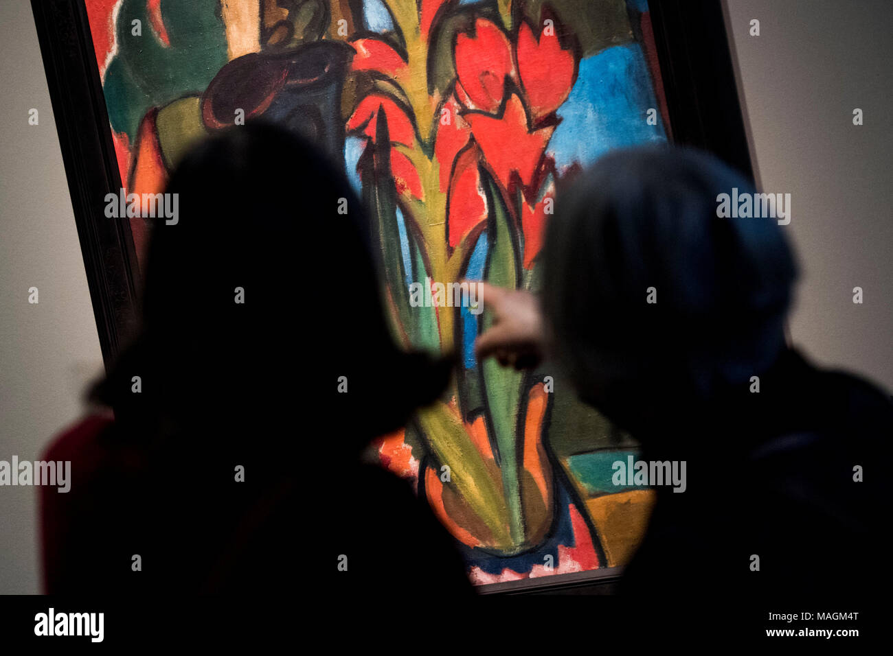 ILLUSTRATION - 16 March 2018, Germany, Hamburg: Two elderly women stand in front of the painting 'Stillleben mit roten Blueten' (lit. still life with red blossoms) by Karl Schmidt-Rottluff at the Bucerius Arts Forum in Hamburg. The Hamburg museum Bucerius Arts Forum offers guided exhibition tours particularly for dementia patients. Photo: Malte Christians/dpa Stock Photo