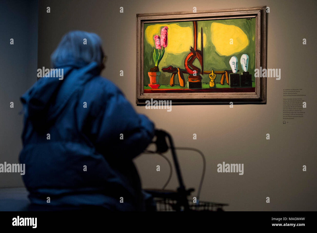 ILLUSTRATION - 16 March 2018, Germany, Hamburg: An elderly woman with rollator looks at the paintings 'Stillleben mit Hyazinthe' (lit. still life with hyacinth) (1938) by Karl Schmidt-Rottluff at the Bucerius Arts Forum in Hamburg. The Hamburg museum Bucerius Arts Forum offers guided exhibition tours particularly for dementia patients. Photo: Malte Christians/dpa Stock Photo