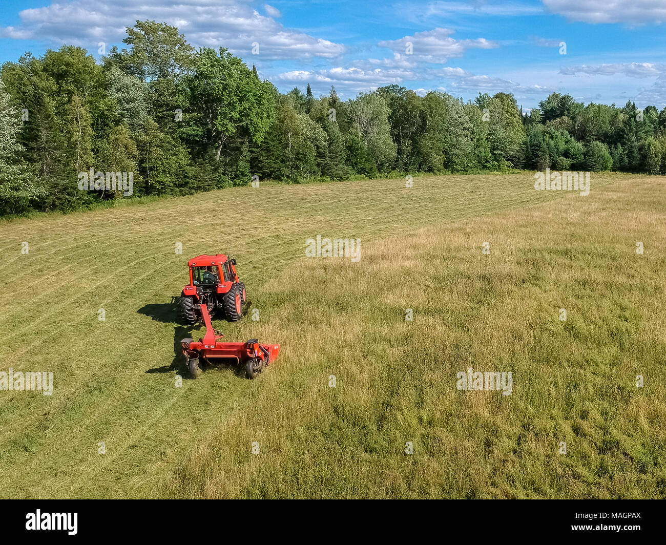 Tractor raking field hi-res stock photography and images - Alamy