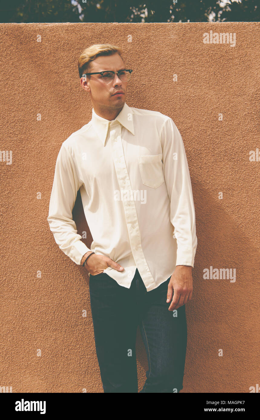 A Caucasian man, male model posing wearing men's 70s vintage shirt, a men's vintage fashion editorial concept. Stock Photo