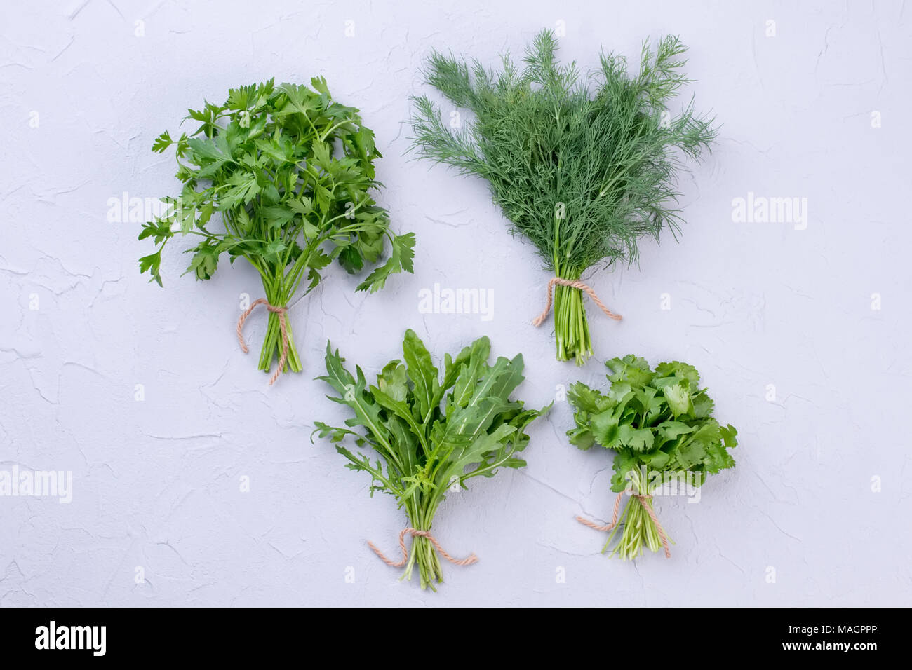 Fresh garden dill and parsley. Parsley, dill and arugula on light