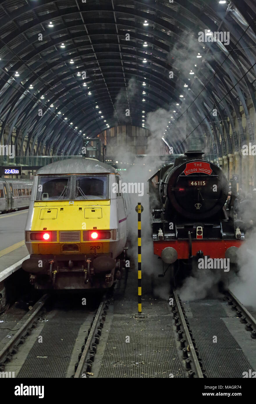 Royal Scot class 4-6-0 steam loco 46115 'Scots Guardsman' and East Coast Railways InterCity 225 at London King's Cross station, 9th November 2014. Stock Photo