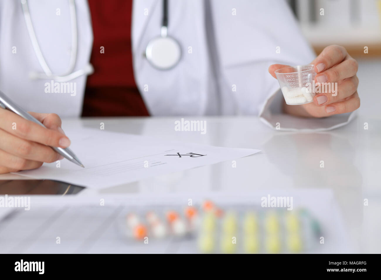 prescription up ... doctor to medicine form patient fills Female