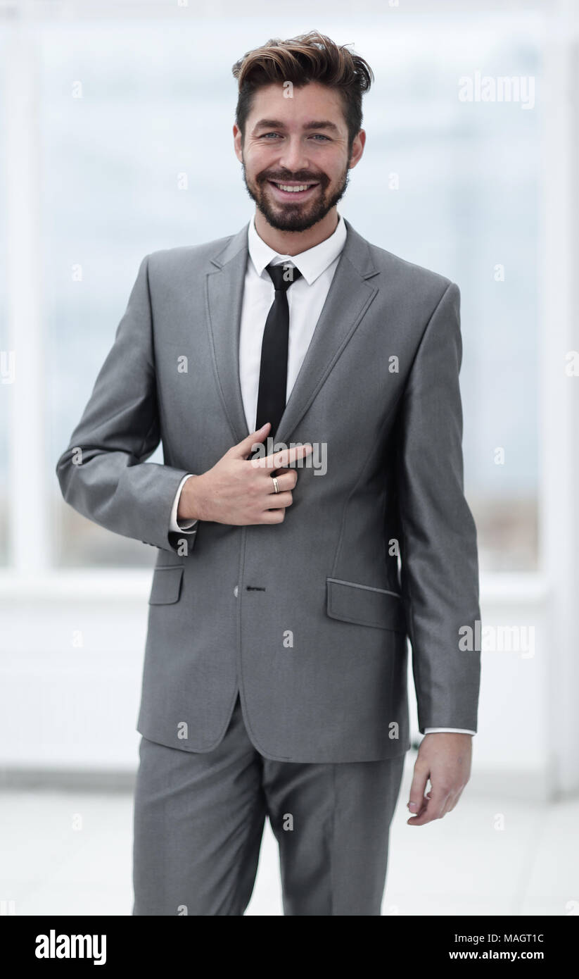 A young man in a gray suit Stock Photo - Alamy