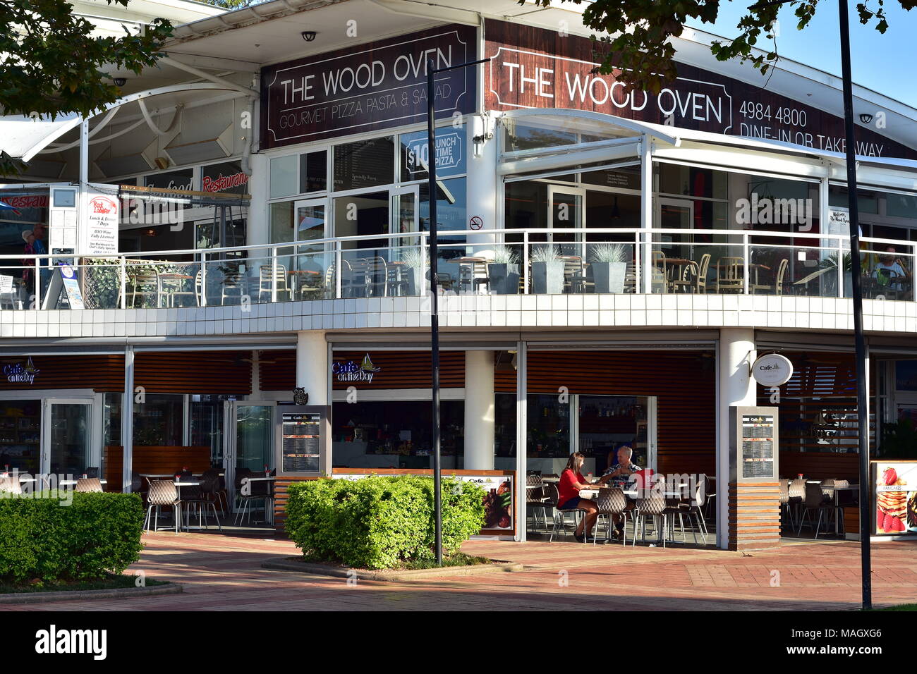 The Wood Oven two story pizzeria in pedestrian zone in front of marina