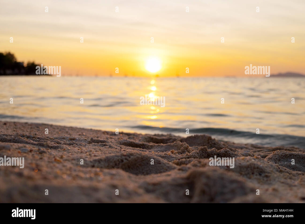 Beautiful sunset above the sea beach Stock Photo - Alamy