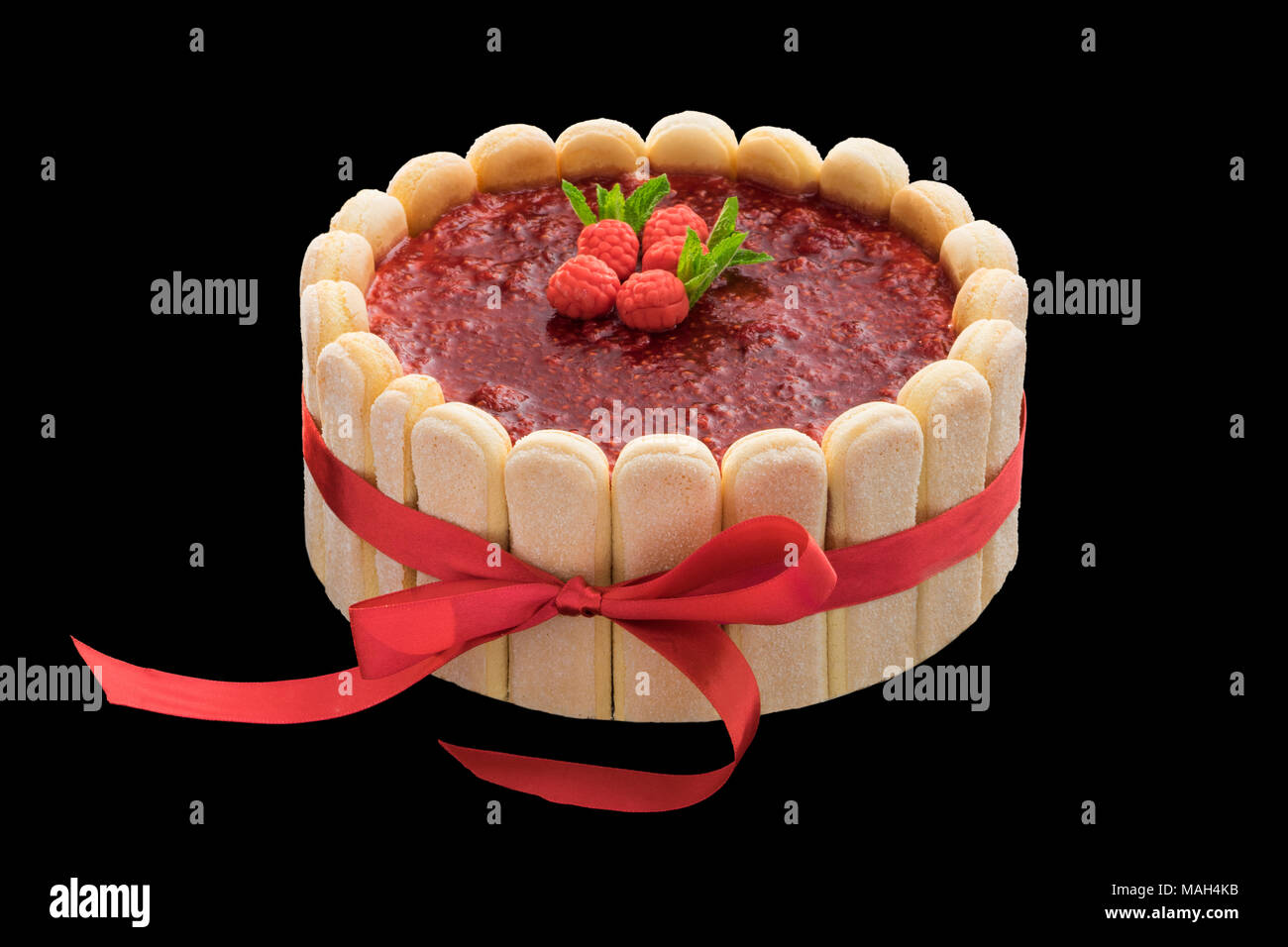 festive raspberry cake with biscuits and a red ribbon Stock Photo - Alamy