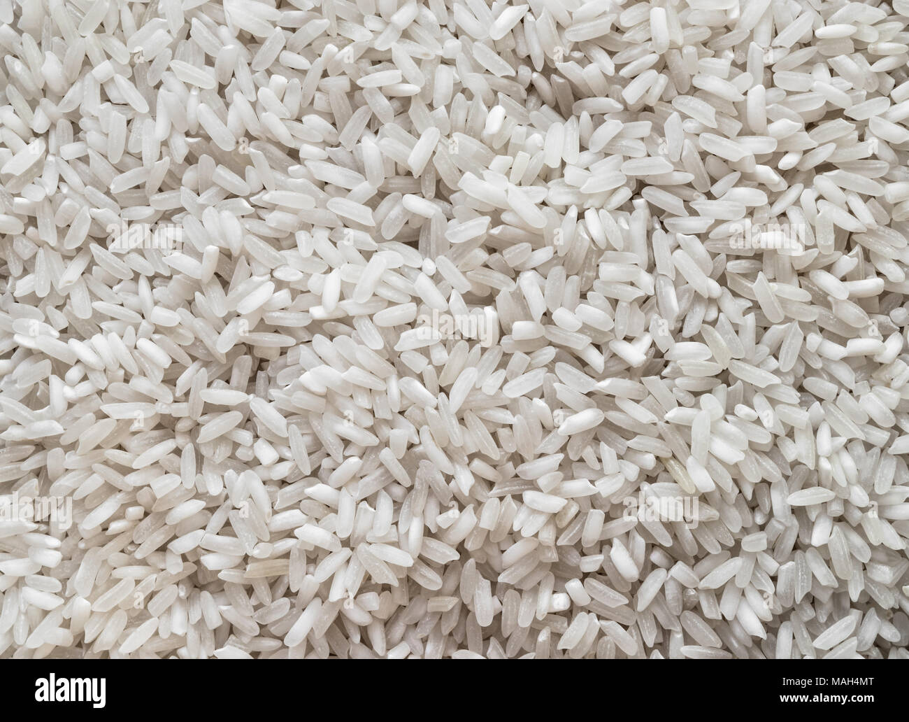 Pile of white rice background surface texture Stock Photo - Alamy