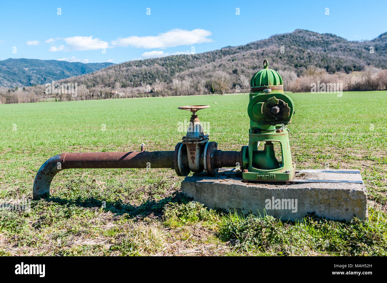surface pump on a crop field, Garrotxa, Catalonia, Spain Stock Photo