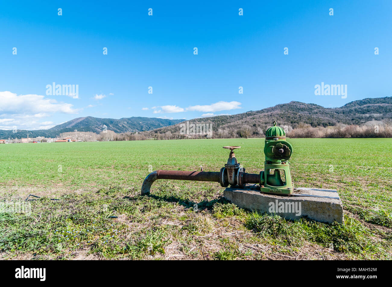 surface pump on a crop field, Garrotxa, Catalonia, Spain Stock Photo